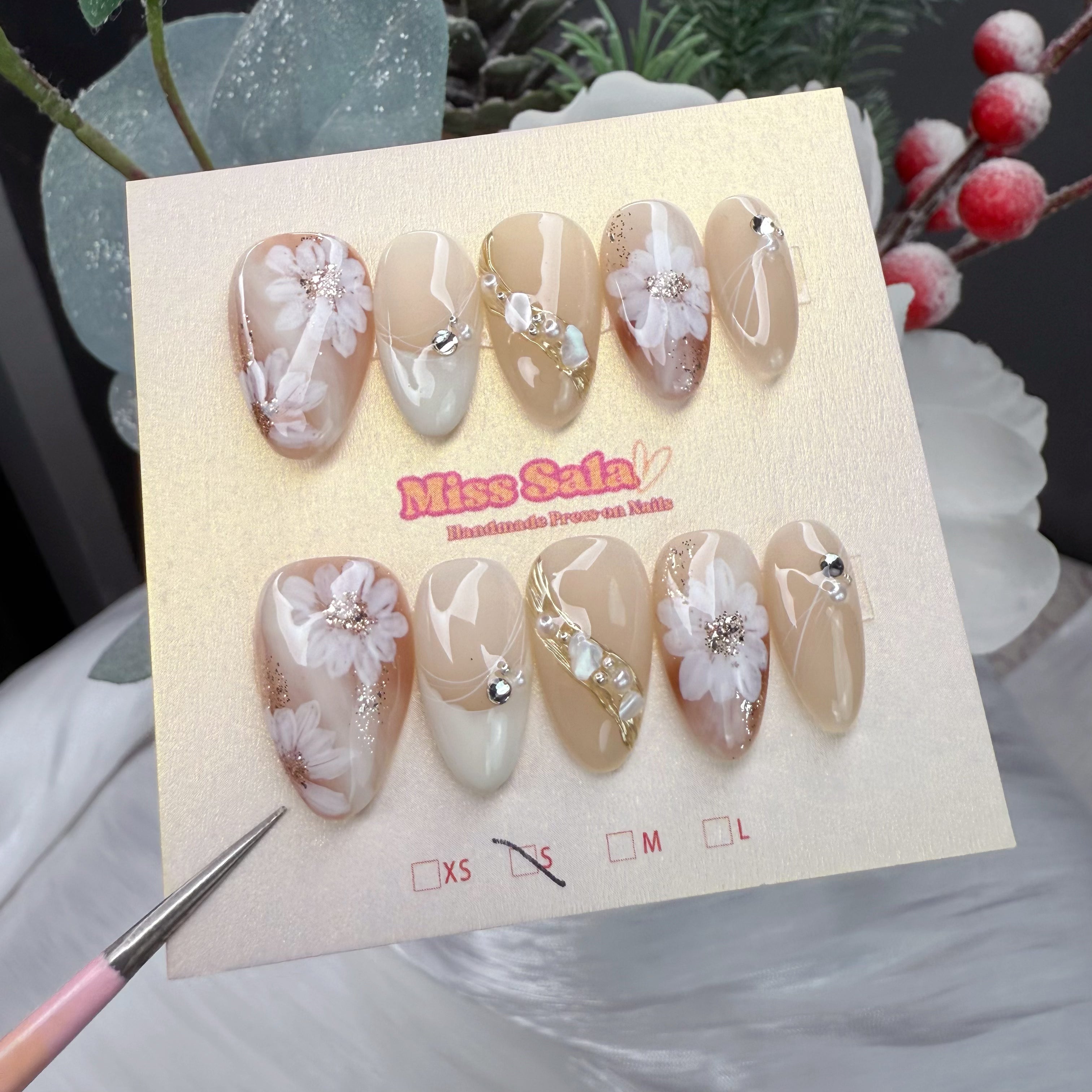 Milk Tea Blossom Press-On Nails - Nude and Cream, Almond Shape with Hand-Painted White Floral Art, Gold Foil Accents, and Crystal Embellishments