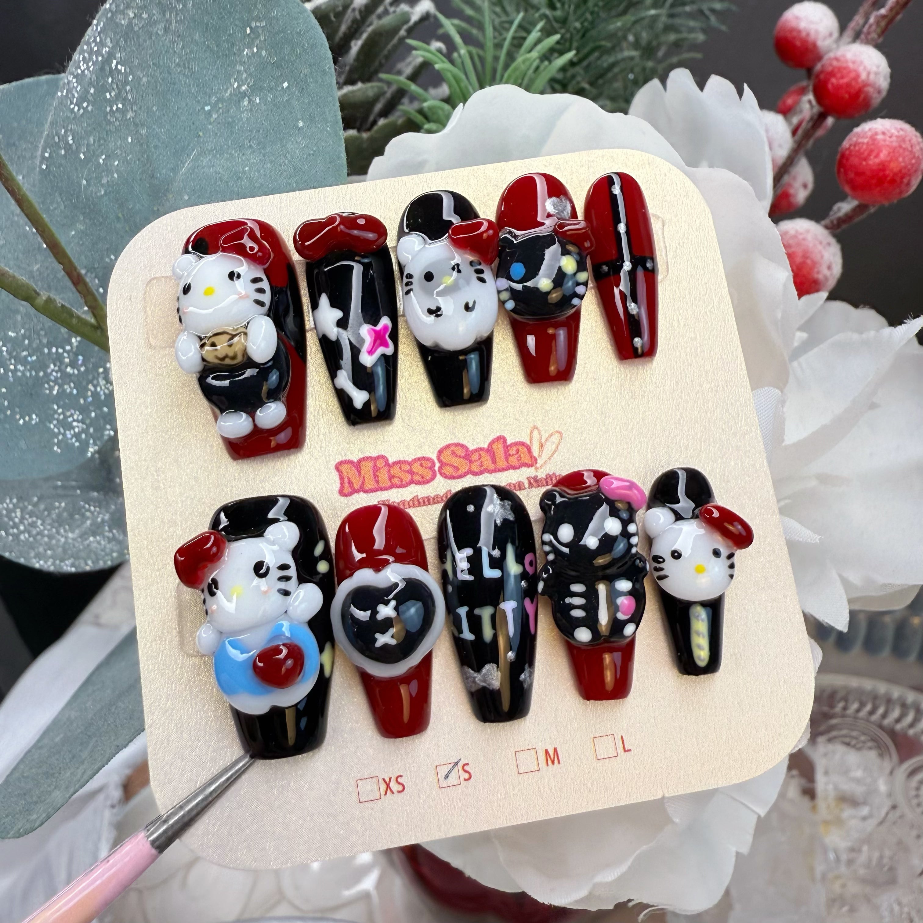 Long Coffin Press-On Nails in Black and Red with 3D Hello Kitty Charms, Skeleton Characters, and Hand-Painted Goth Art
