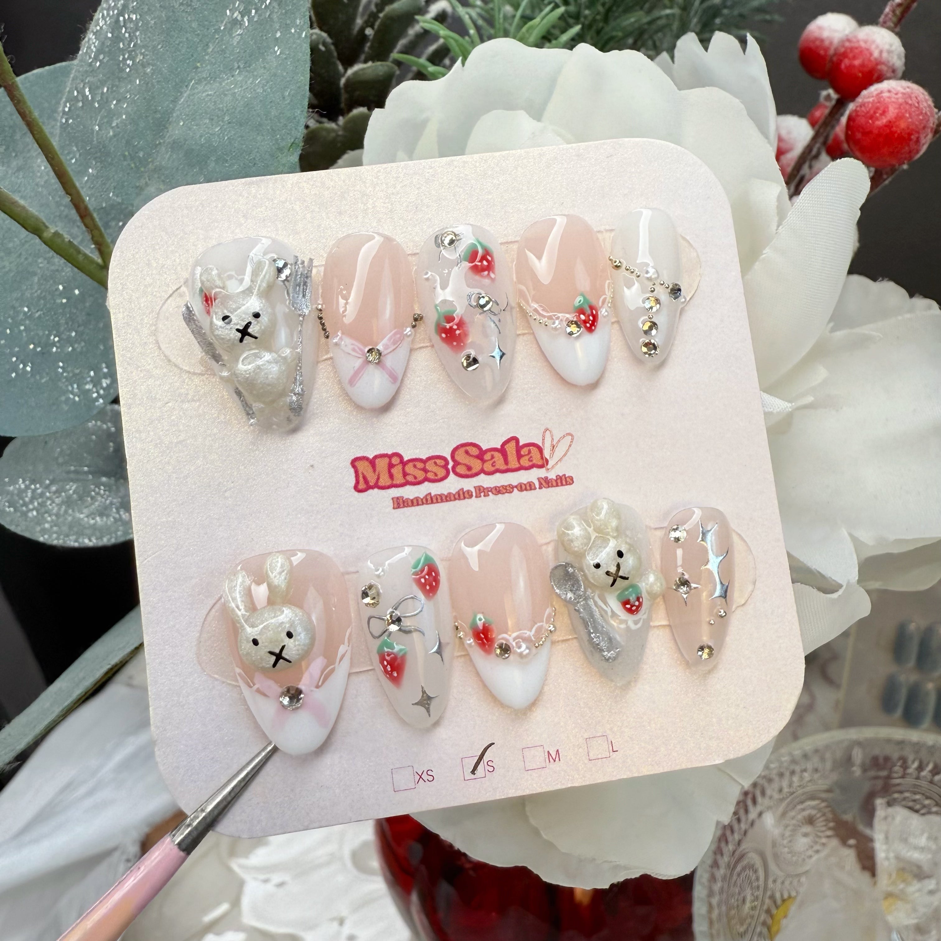 Almond-Shaped Press-On Nails with a Nude and White Base, 3D Bunny, Hand-Painted Strawberries, 3D Silver Spoons, and Delicate Pink Bows