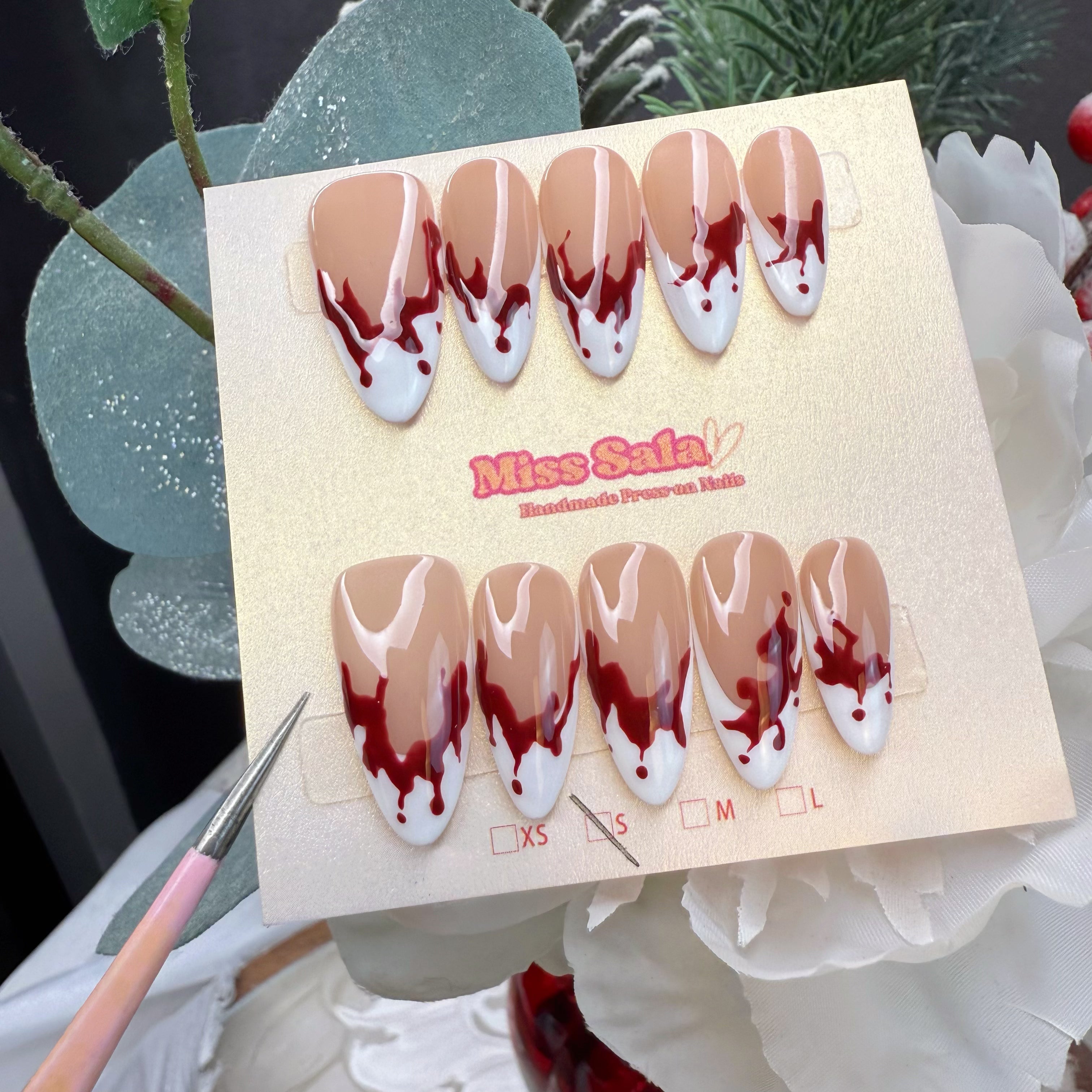 Almond-Shaped Press-On Nails with Nude Base, White French Tips, and Hand-Painted Crimson Red Blood Drip Art