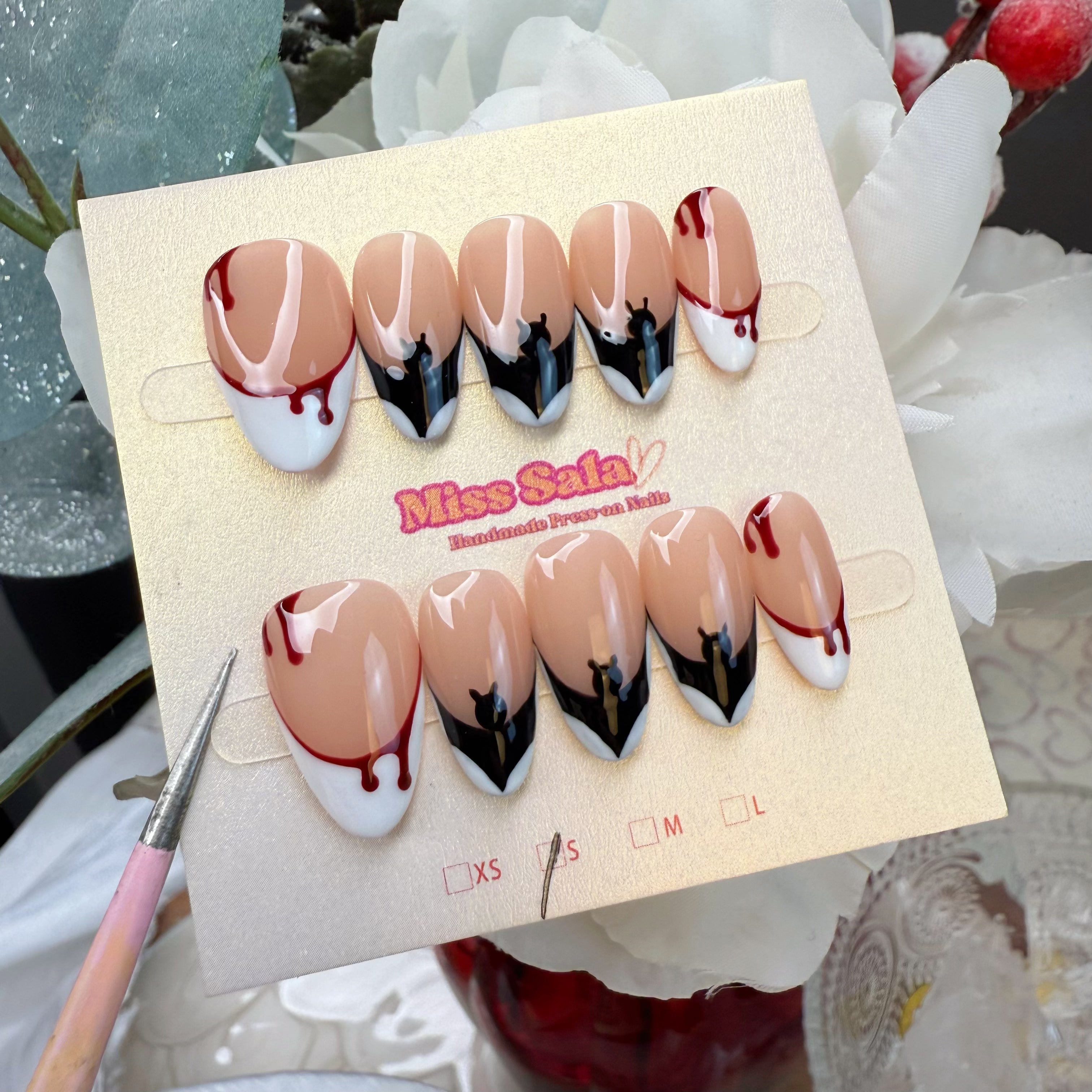 Almond-Shaped Press-On Nails with Nude Base and White French Tips, Featuring Hand-Painted Black Bat Wings and Red Dripping Blood Art